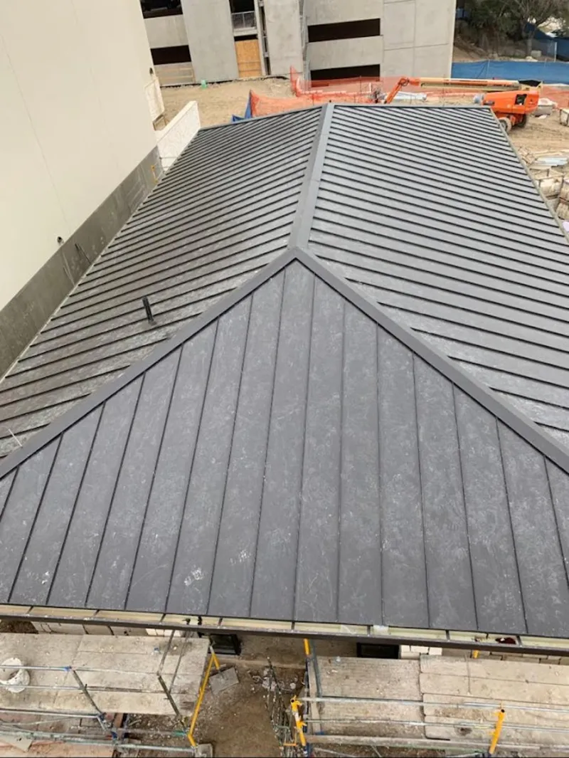 Commercial metal roof construction with crane equipment in Opa-locka